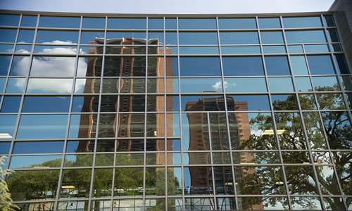 photo of TWU dorms, Guinn and Stark, in reflection