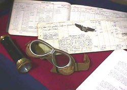 collage with flight goggles and documents