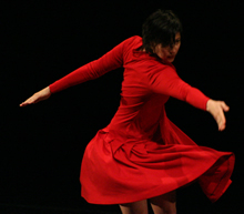 Andee Scott dancing in a red dress