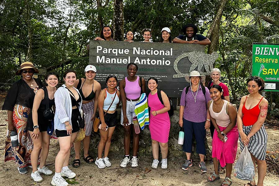 students stand in front of and on top of a Manuel Antonio National Park
