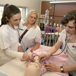 TWu nursing students practicing skills