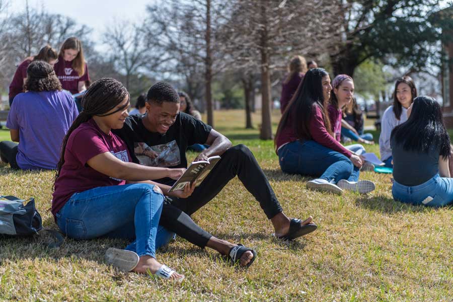 A group of students hang out on the lawn with Oakley with the university fact "5th place for diversity among US universities" displayed below them.