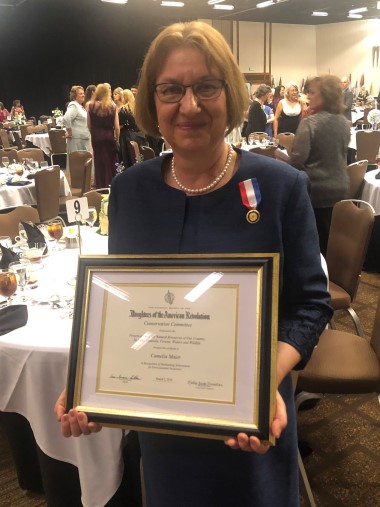 Camelia Maier, Ph.D., with her NSDAR Conservation Medal and certificate.