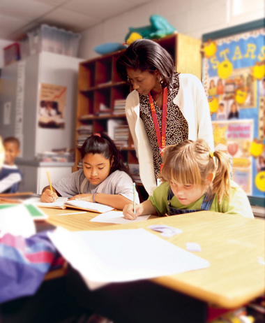 Student teaching a class of grade school children