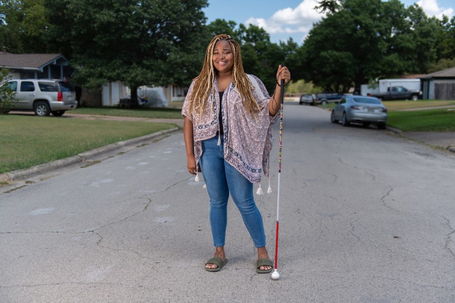 TWU student Demetria Ober in front of her Fort Worth home.