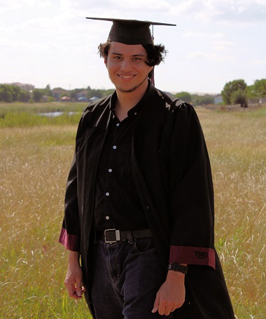 Alexander Delacruz-Nunez in cap and gown