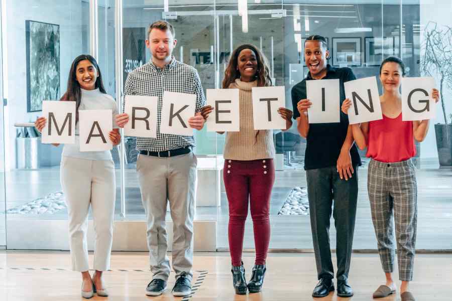 people holding marketing sign