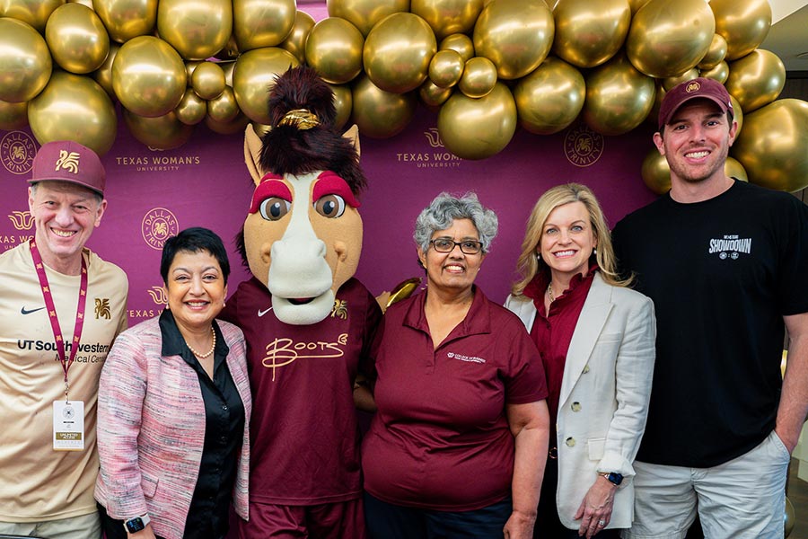 Executive Dean Yelkur and associate dean Pushkala Raman stands with Trinity FC leadership 