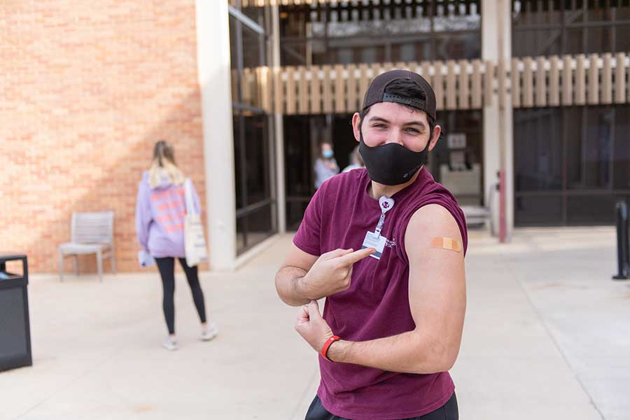 A TWU student after receiving their COVID vaccine shot on campus.