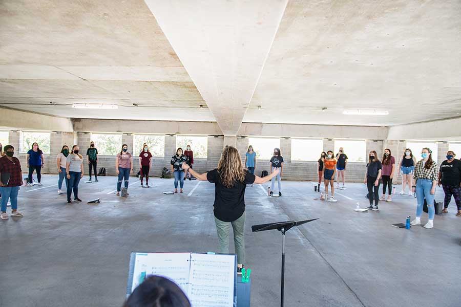 TWU's choir practices in the parking garage to follow COVID safety guidelines.