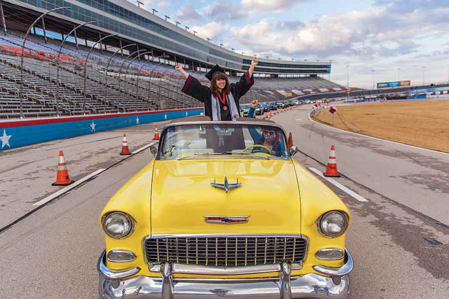 A TWU student at the Texas Motor Speedway graduation ceremony.