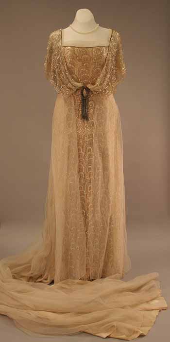 A gown made of white China silk with sequin-embroidered lace with a long train made of white chiffon