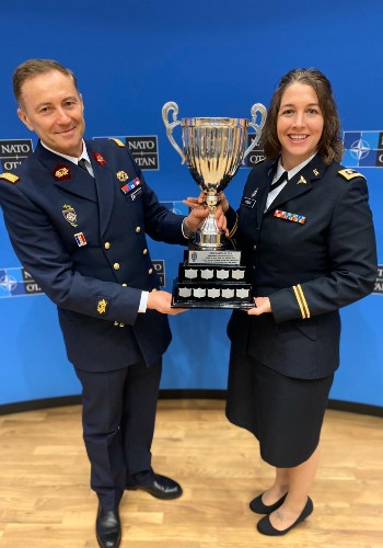 Brig. Gen. Francois R. Martelet, France (left), presents the Martelet Cup to Maj. Katie Odom, USAR.