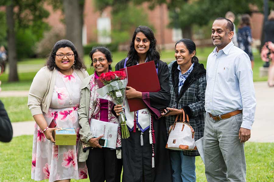 Honors Scholar Program graduate Annamayil Manohar and family at commencement, 2019
