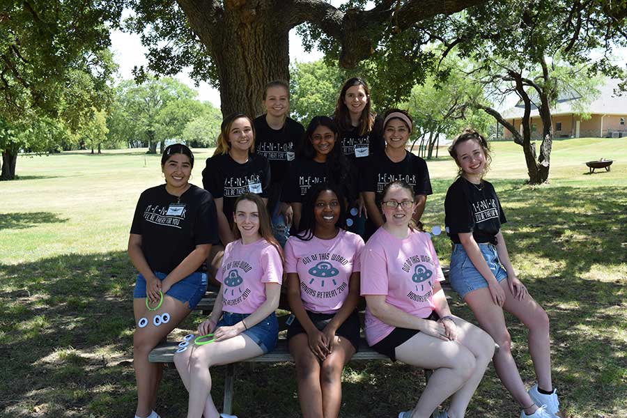 A group photo of honors mentors outdoors on the Denton campus.