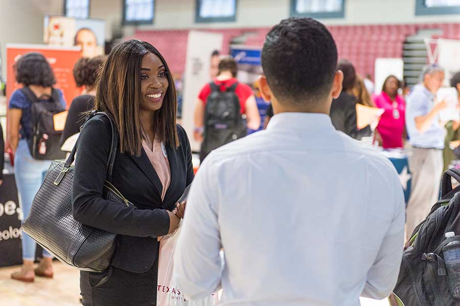 A TWU student at a career fair.