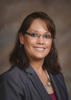 A portrait of Becky Rodriguez smiling.