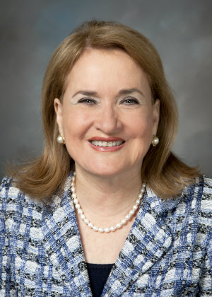 A portrait of Sylvia Garcia smiling.