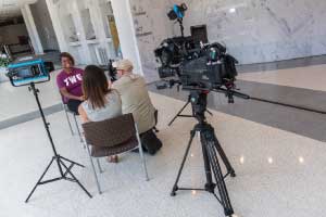 A TWU student is interviewed by a TV station for her outstanding accomplishments.	