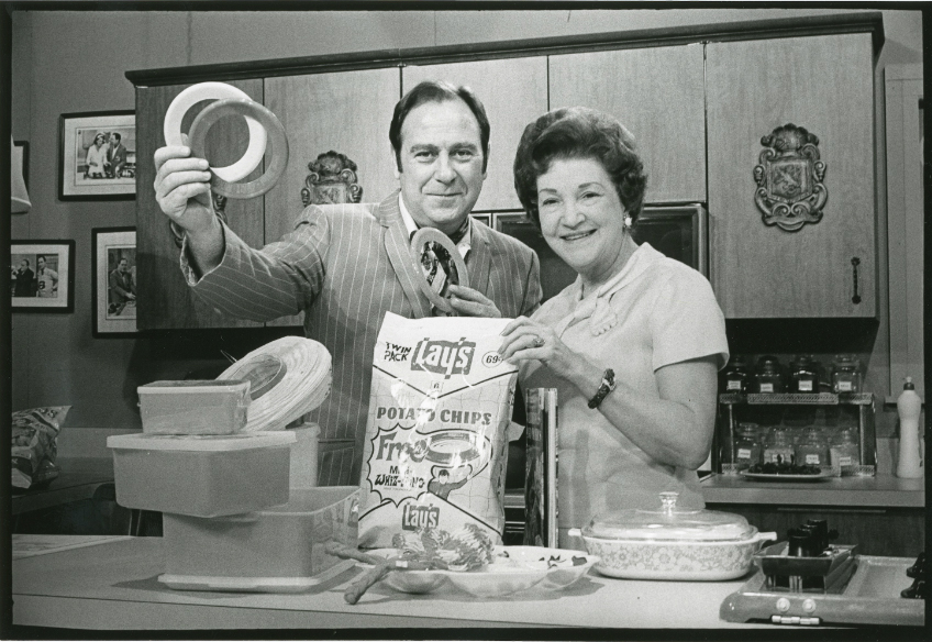 Nell Morris demonstrates one of her recipes using Frito-Lay products with KDFW-TV Reporter David Wade