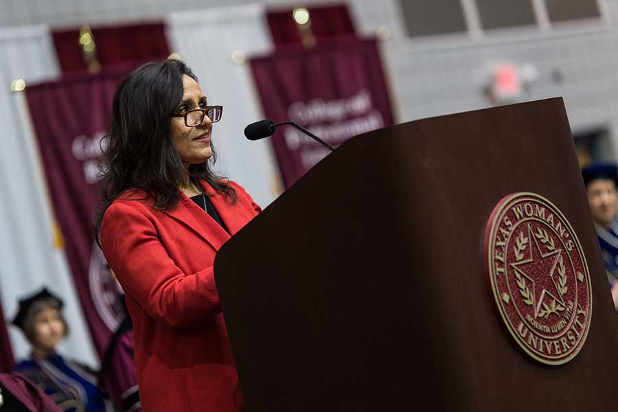 Alia Moses speaks at TWU's Denton commencement ceremony in Kitty Magee Arena.