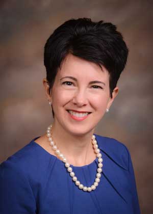 A headshot of Carolyn Kapinus.