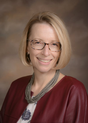 A portrait of Raechelle Clemmons smiling.