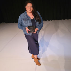 Elisa De La Rosa accepts TWU Campus Leader with a Heart during the 2022 Redbud Awards.