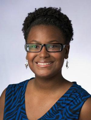 A portrait of Kinesiology student Ayana Georges smiling.