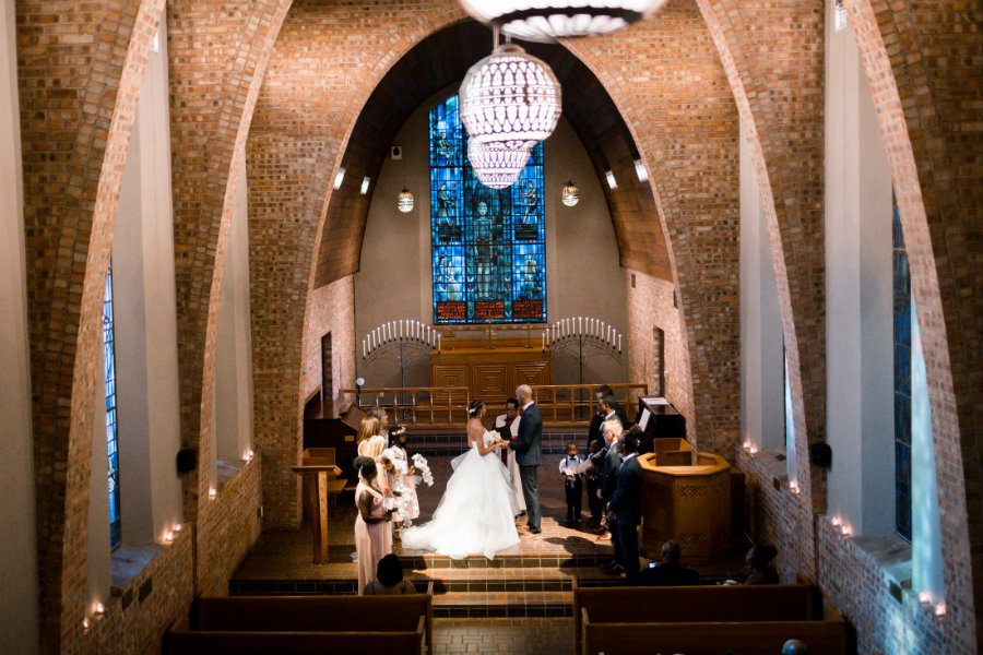 A couple getting married inside the Little Chapel.