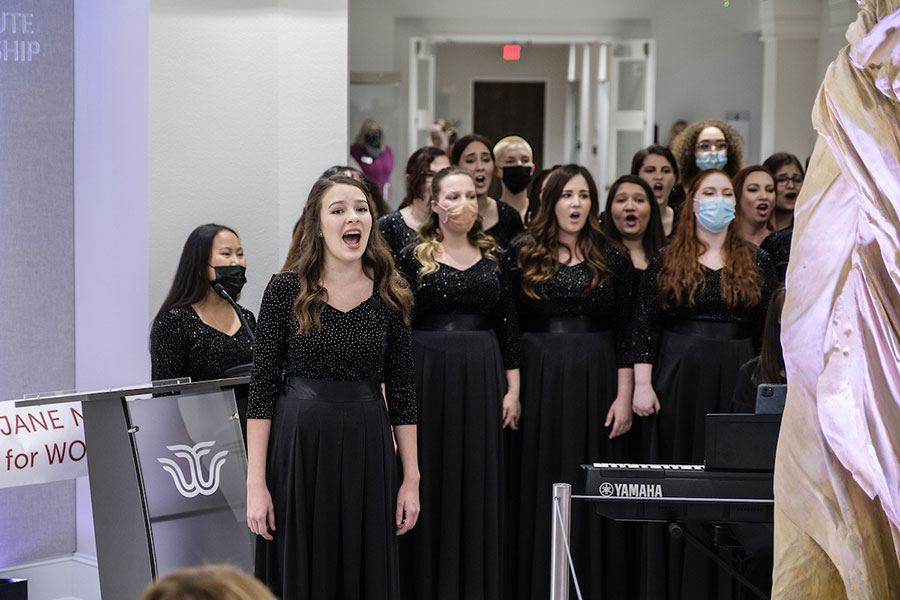 Rachel Wresh sings with TWU's choir at a grand opening.	