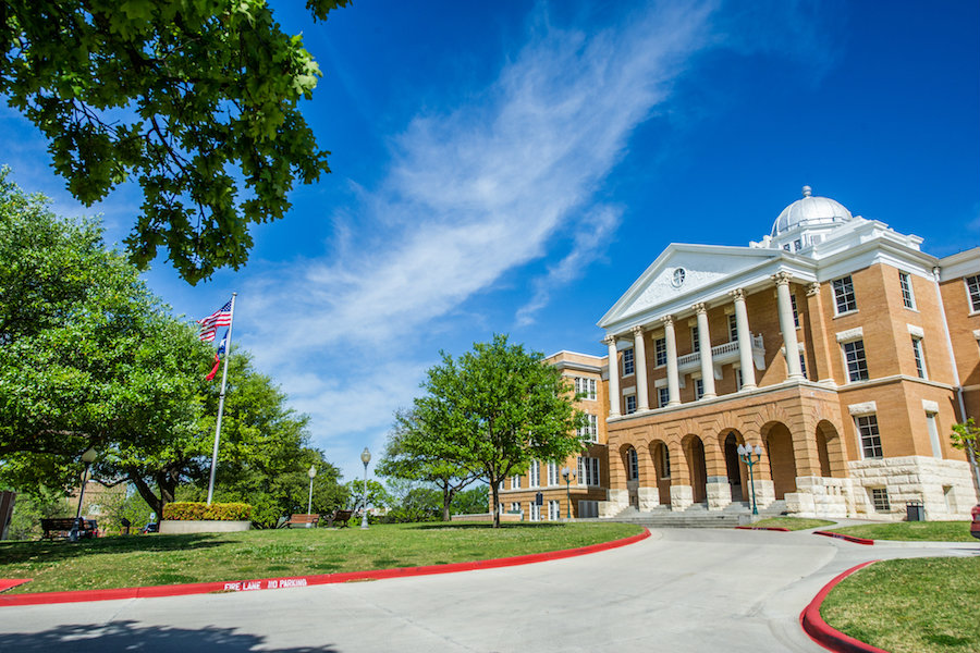 Brick building with white Georgian columns.