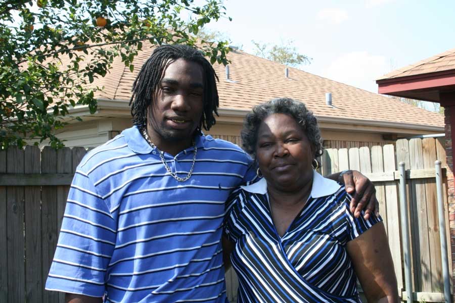 Ryan Matthews and his mother, Pauline Matthews, smile outdoors.