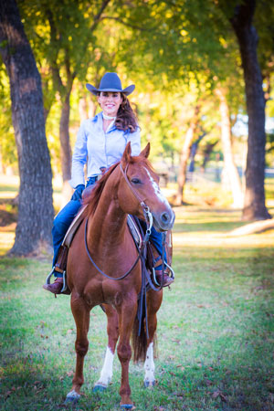 Stacie McDavid riding a horse.