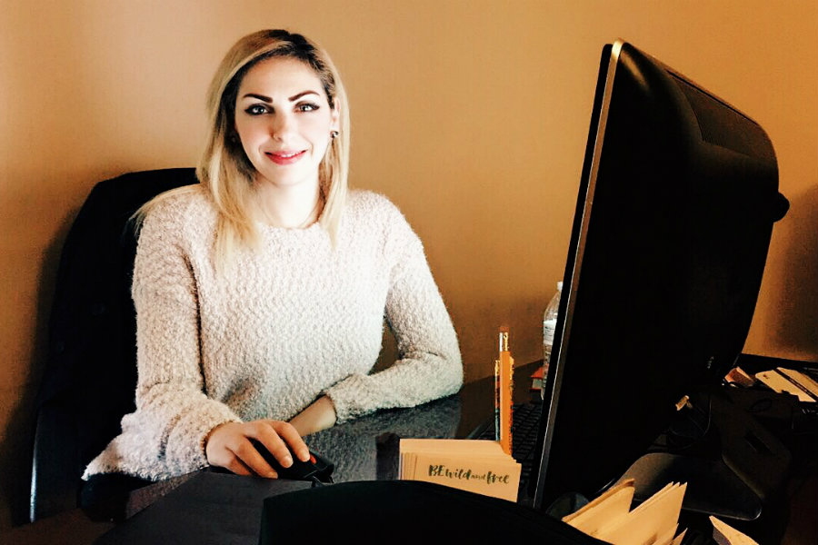 Laila Tubaila working at her desk.