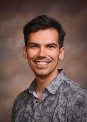 A portrait photo of a smiling William Benner.