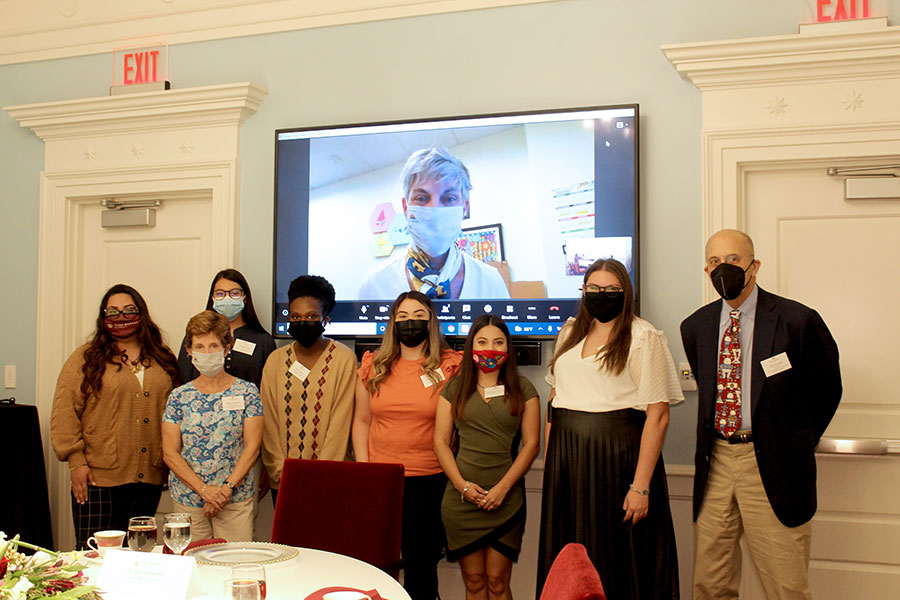 Woolf Foundation members and scholarship recipients at an event.