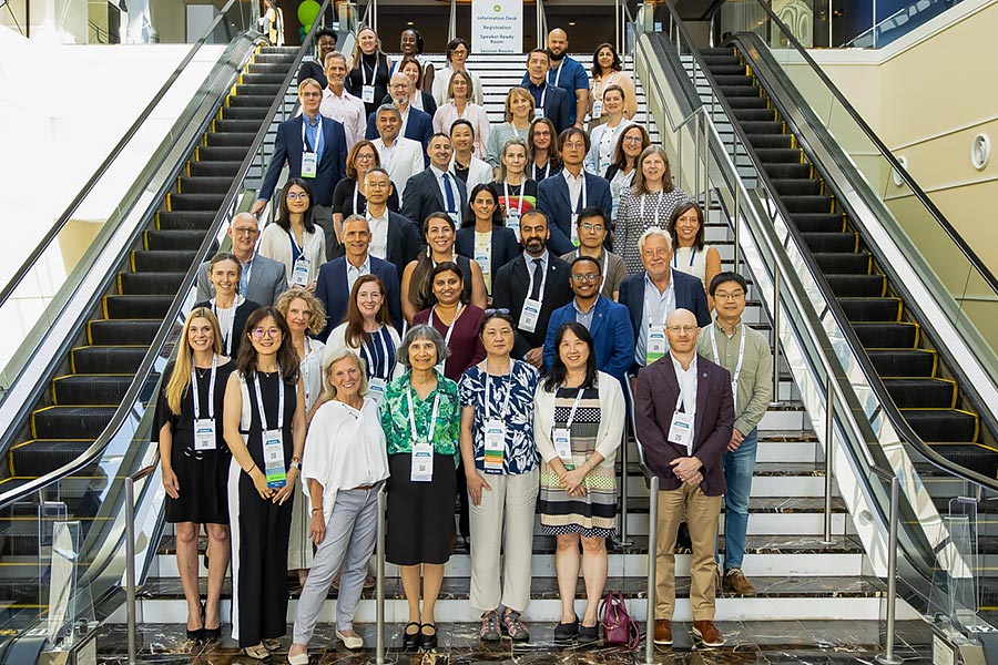 69 nutrition fellows stand on an escalator and staircase