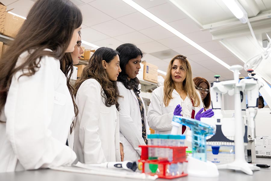 Nutrition professor instructs students in lab