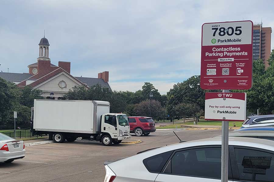 ParkMobile parking sign at TWU's main visitor lot.