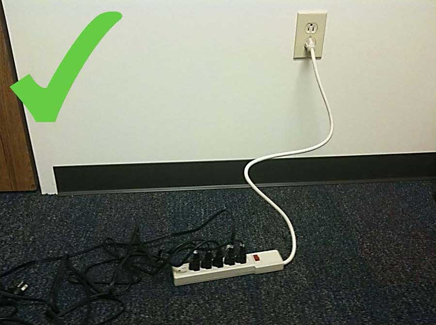 A power strip plugged directly into a wall outlet
