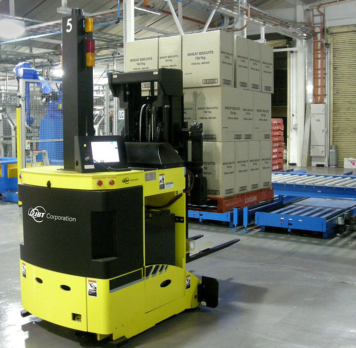 A pallet jack with boxes on it in a warehouse.