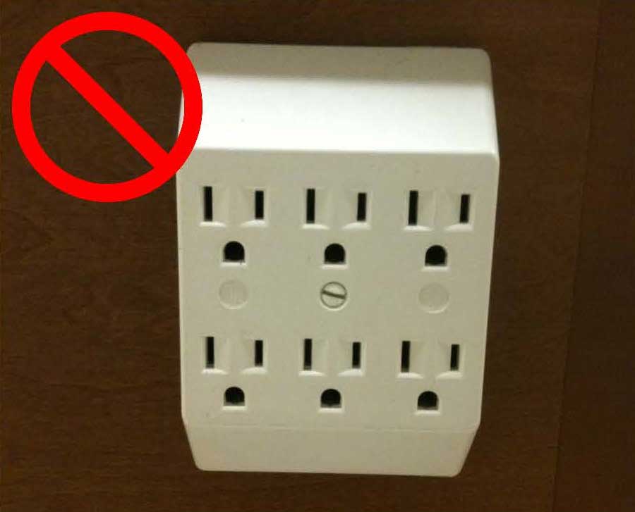 A prohibited multi-outlet adapter without a circuit breaker