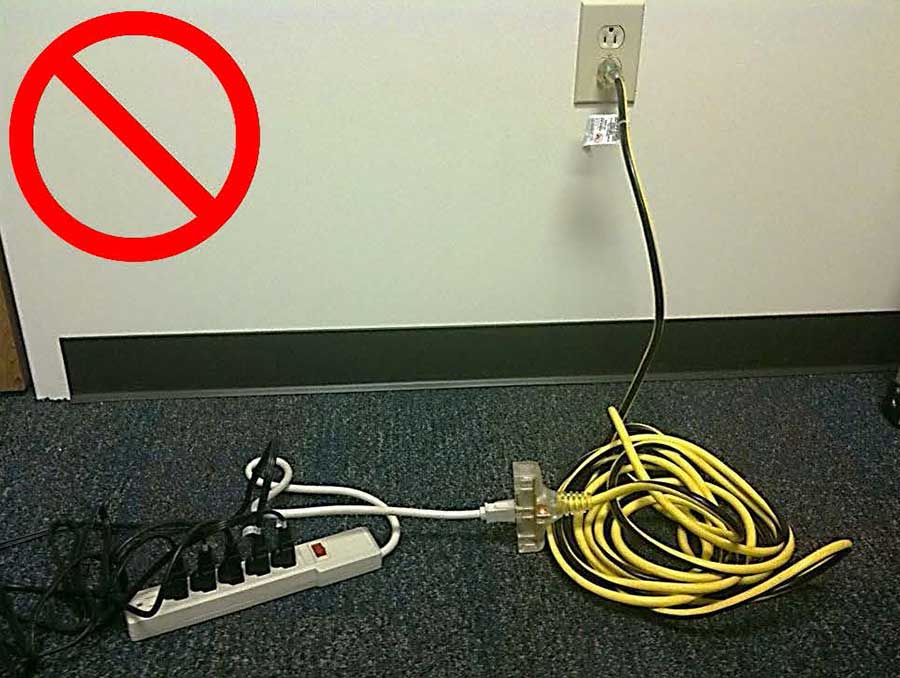A power strip plugged into an extension cord