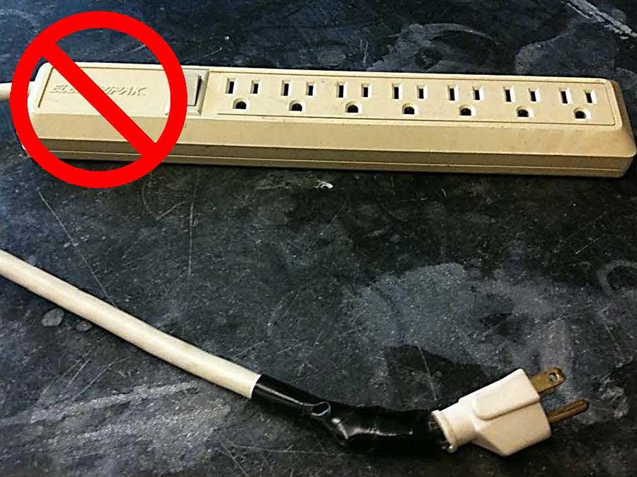 A taped and damaged power strip