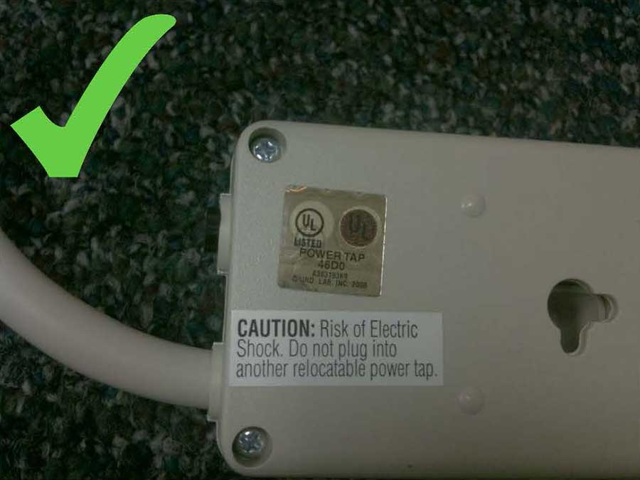 A UL Listed sticker on the back of a power strip