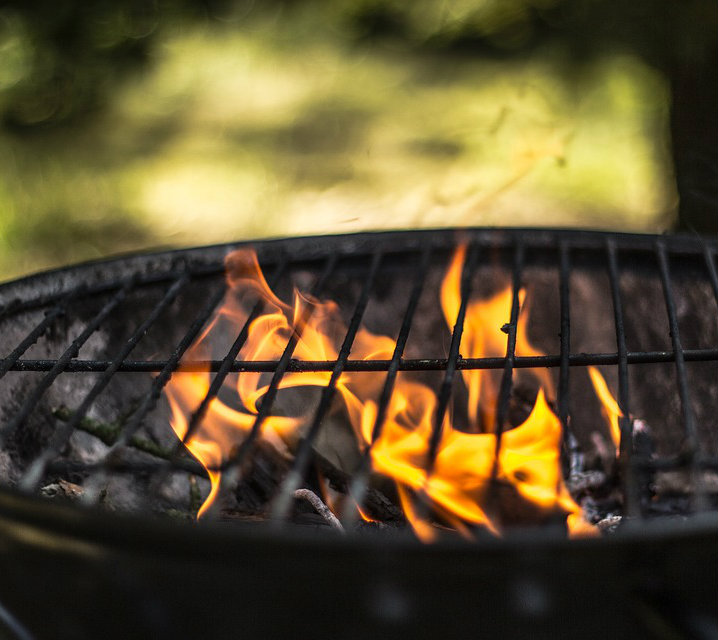 An empty grill with flames.