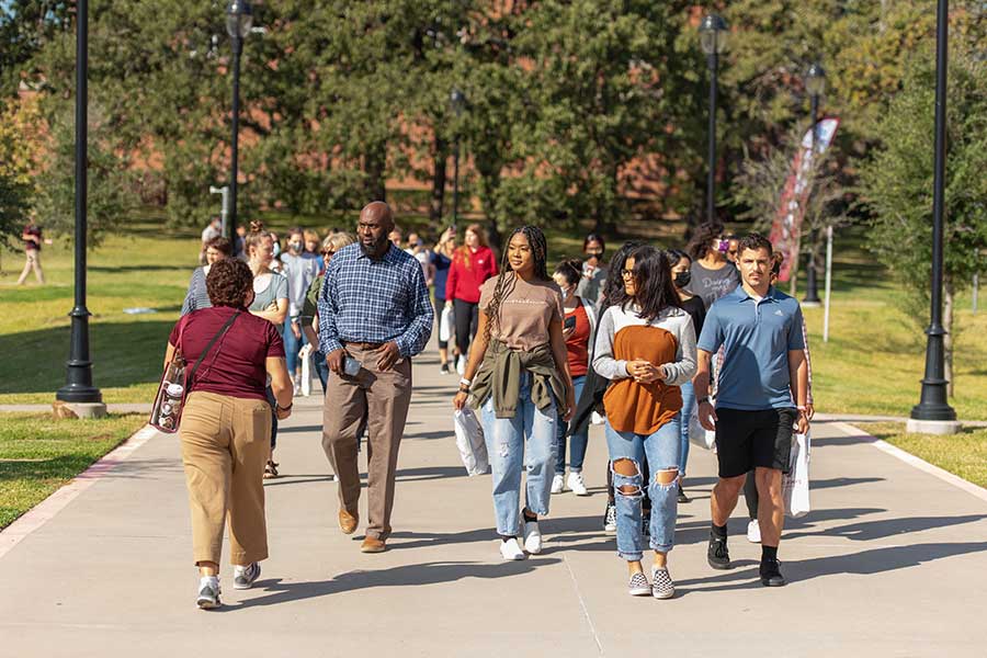 Prospective students take a campus tour during a Pioneer Preview Day event.	