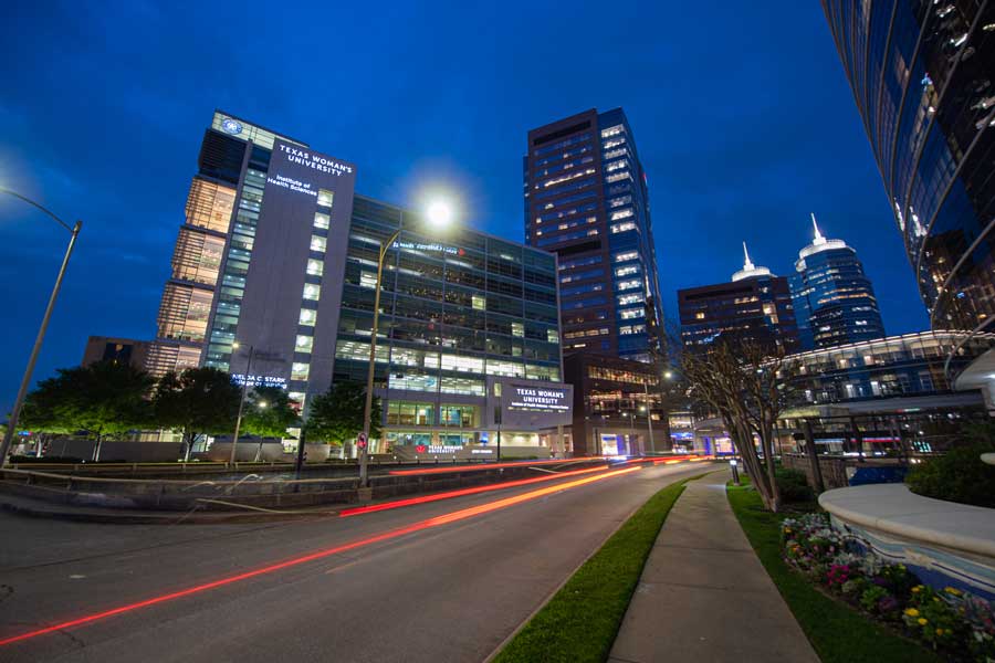 TWU's Houston campus lit up at night.