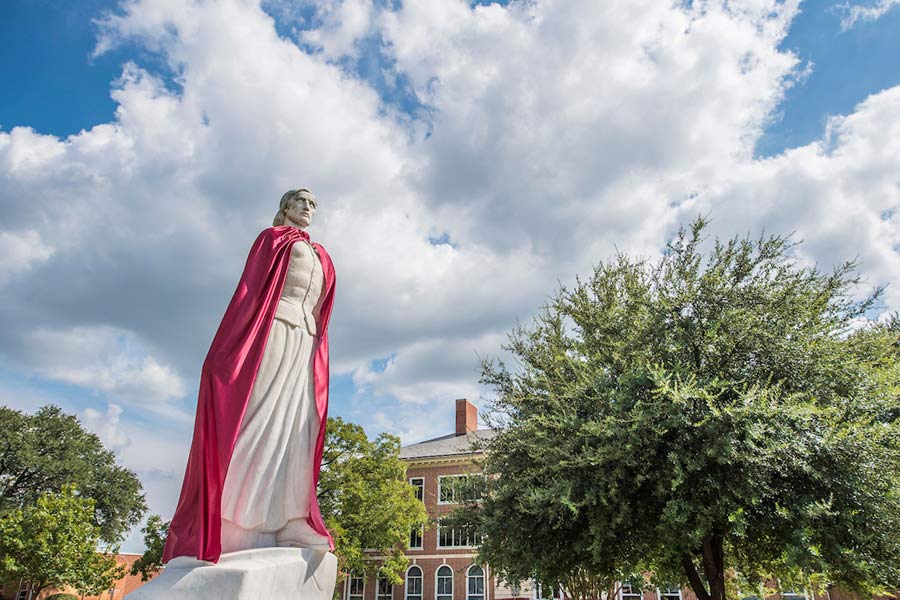 TWU Minerva statue wearing a maroon cape.